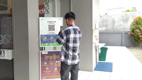 Men scan the QR code to enter the building Stock Footage 170786995