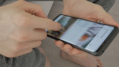Men scrolls through instagram feed and liking photos Stock Footage 112255145
