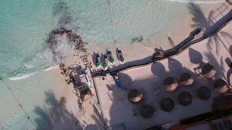 Men setting up a tent on the beach in Cancun, Mexico Stock Footage 87045504