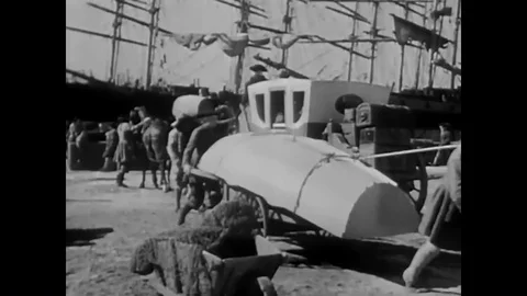 Men settle into the American frontier in 1940, chopping wood, building homes, Video stock 99362622