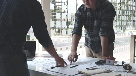 Men shake hands after the deal is done, Architects and engineers join hands t Stock Footage 155158210