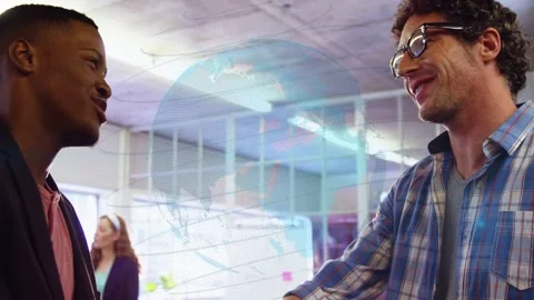 Men shaking hands in office, initiating camera pullback and globe overlay Stock-Footage 333704963