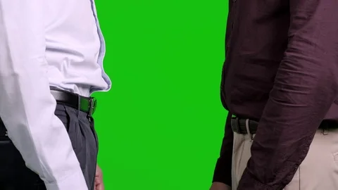 Men shaking hands pose with green screen on background. Confident shake. Stock Footage 105305724