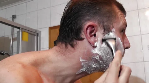 Men shaving in the bathroom Stock Footage 22708892