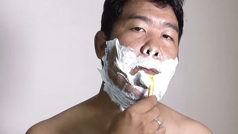 Men shaving in the bathroom. Stock Footage 84350406