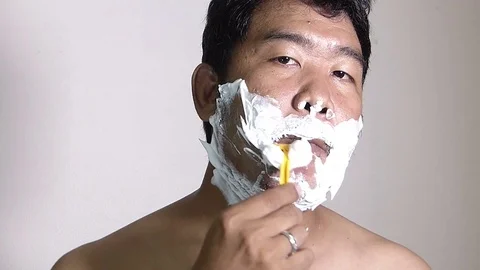 Men shaving in the bathroom. Stock Footage 84350489