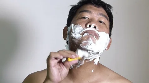 Men shaving in the bathroom. Stock Footage 84350547