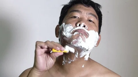 Men shaving in the bathroom. Stock Footage 84350649