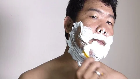 Men shaving in the bathroom. Stock Footage 84350663