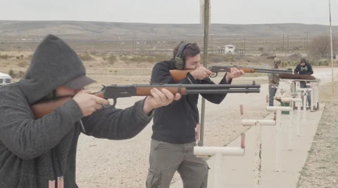 Men Shooting Rifles at the Gun Range Stock Footage 60707123