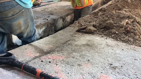 Men Shoveling on Construction Site Видео 81339154