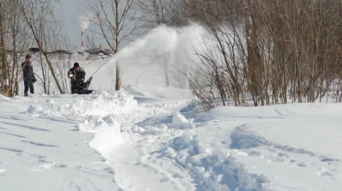 Men shoveling snow machine and shovel Stockbeeldmateriaal 36674932