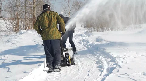 Men shoveling snow machine and shovel Stockbeeldmateriaal 36677967
