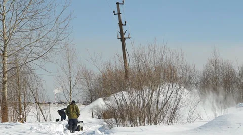 Men shoveling snow machine and shovel Stock Footage 36679623