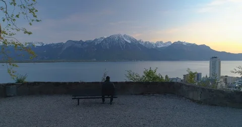 Men sitting on a bench in front of beautiful winter view Stock Footage 117363204