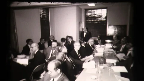 Men Sitting at Table, American Life, Small Town Meeting Local Community Center Stock Footage 130355343