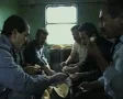 Men sitting in train carriage eating together SD Footage