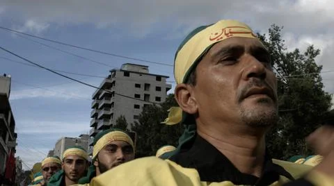Men slap their chests during Hezbollah's Ashoura procession in Nabatieh, Lebanon Stock Photos