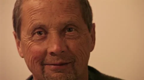 Men is smiling into the camera Stock Footage 57358378