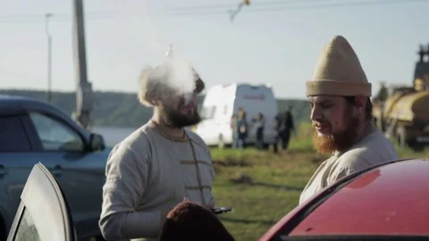 Men smoke electronic hookah Stock Footage 82362741