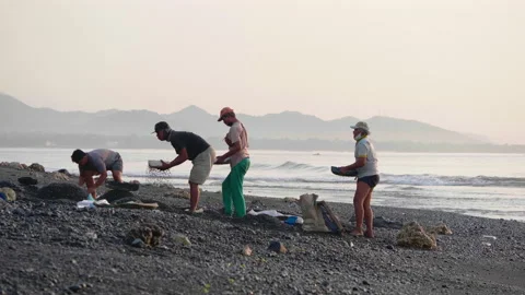 Men Sorting Stones on the Beach, Bali Stock Footage 147269335