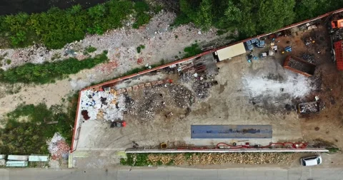 Men Sorting Trash Makeshift Recycling Compound Tropical India Drone Slow Descend Stock-Footage 300444695