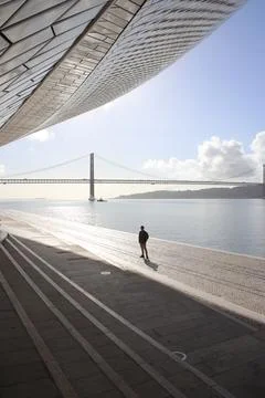 Men in square floors and bridge with modern city skyline scenery at sunrise Stock Photos