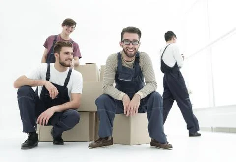 Men with stacked boxes isolated on white. Stock Photos