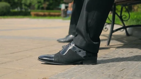Men stand up from bench and go away Stock Footage 87946799