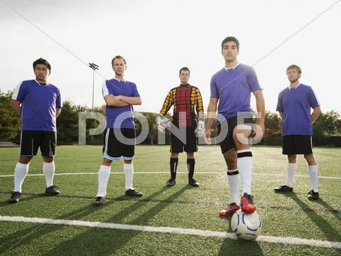 Men Standing With Ball On Soccer Field