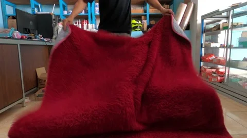 Men Standing Folding Fresh Clean Red Carpet After Laundry At Home Stock Footage 157407073