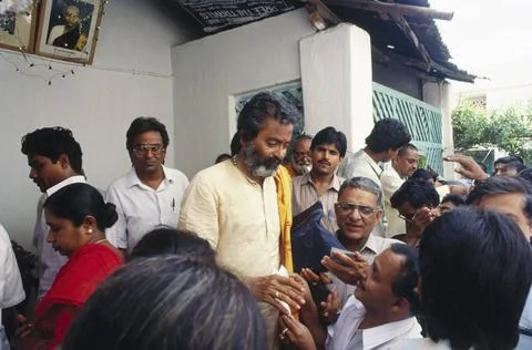Men standing in queue for fishy cure treatment, india Copyright: xRajeshxV... Stock Photos