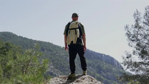 The men stands on the top of the mountain Stock-Footage 307606641