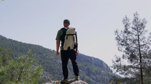 The men stands on the top of the mountain Stock Footage 307606790