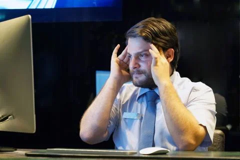 Men in stress in front of computer Stock Photos