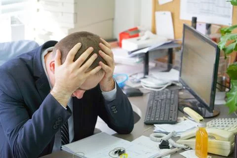 Men stressed out at work Stock Photos