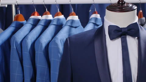Men suits and Jackets hanging in a clothing store Stock Footage 89968057