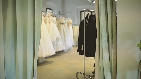 Men suits on a coat hanger Stock Footage 86438607