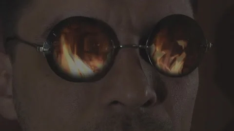 Men in sunglasses, looking at the fire Stock Footage 49965401