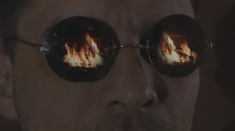 Men in sunglasses, looking at the fire Stock Footage 49965450