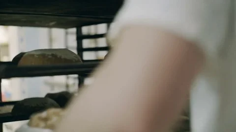 Men take bread from trays Video stock 76880488