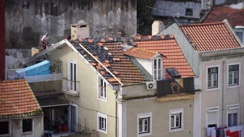 Men Taking Risks Working On Rooftop of House Stock Footage 76256485