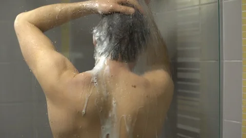 Men taking a shower Stock-Footage 104490015