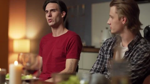 Men talking to friends at dining table Stock Footage 114815350