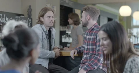 Men talking in pub Stock Footage 43695524