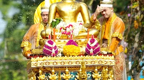 Men with Thai Ancient Angle costume with the Buddha statue in the parade Stock Footage 49182698