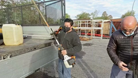 Men Tooking Machinery for Working While Wearing a Medical Masks Stock-Footage 143192268