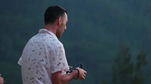 Men tourist using drone with remote controller Stock Footage 174678887