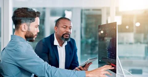 Men, trading and computer screen with tablet, talking and review at office with Stockfoto's