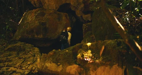 Men on a trail inside a giant cave Stock Footage 162524631